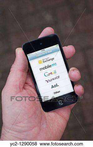The new Apple Ipod touch 4th generation 4G 32gb media player with internet connection showing various email options View Large Photo Image Stock Photo - The new Apple Ipod touch 4th generation 4G 32gb media player with internet connection showing various email options. Fotosearch