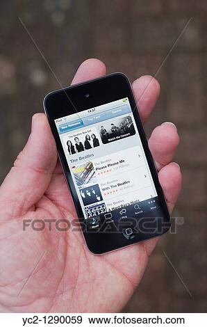 The new Apple Ipod touch 4th generation 4G 32gb media player with internet connection showing itunes store View Large Photo Image Stock Photo - The new Apple Ipod touch 4th generation 4G 32gb media player with internet connection showing itunes store. Fotosearch