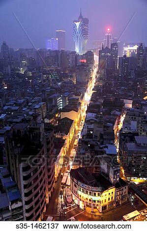 Stock Photo - The night view of main commerical street of Avenida de Almeida Ribeiro with Grand Lisboa Hotel and Casino in background Macau China.. Fotosearch