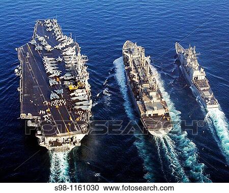 The Nimitz-class aircraft carrier USS Harry S Truman CVN 75 and the guided missile cruiser USS Monterey CG 61 conducts a replenishment at sea with the Military Sealift Command MSC fast combat support ship USNS Arctic T-AOE 8 in the North Persian Gulf View Large Photo Image Stock Image - The Nimitz-class aircraft carrier USS Harry S Truman CVN 75 and the guided missile cruiser USS Monterey CG 61 conducts a replenishment at sea with the Military Sealift Command MSC fast combat support ship USNS Arctic T-AOE 8 in the North Persian Gulf . Fotosearch