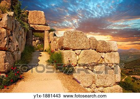 The North Postern Gate of Mycenae 1250 B C Made from four Monolithic blocks of? Almond Stone? in a typical form of two upright jams, A lintel over the top and threshold Mycenae UNESCO World Heritage Archaeological Site, Peloponnese, Greece View Large Photo Image Stock Image - The North Postern Gate of Mycenae 1250 B C Made from four Monolithic blocks of? Almond Stone? in a typical form of two upright jams, A lintel over the top and threshold Mycenae UNESCO World Heritage Archaeological Site, Peloponnese, Greece. Fotosearch
