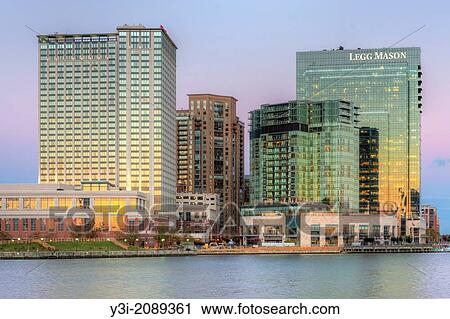 The orange colored western reflects in the windows of part of the skyline of the Harbor East development, including the Baltimore Marriott Waterfront Hotel and the Legg Mason Building at twilight in Baltimore, Maryland. View Large Photo Image Stock Image - The orange colored western reflects in the windows of part of the skyline of the Harbor East development, including the Baltimore Marriott Waterfront Hotel and the Legg Mason Building at twilight in Baltimore, Maryland.. Fotosearch