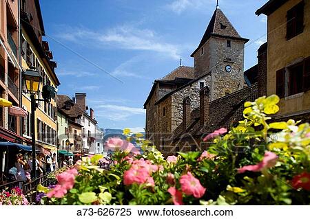 The Palais (palace) de l? Ile and the flowers of the riverside. Annecy. France. View Large Photo Image Stock Photography - The Palais (palace) de l? Ile and the flowers of the riverside. Annecy. France.. Fotosearch