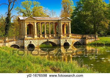 The Palladian Bridge 1774 designed by James Gibbs over the lake in the English landscape gardens of Stowe, designed by Capability Brown Buckingham, England View Large Photo Image Stock Photo - The Palladian Bridge 1774 designed by James Gibbs over the lake in the English landscape gardens of Stowe, designed by Capability Brown Buckingham, England. Fotosearch