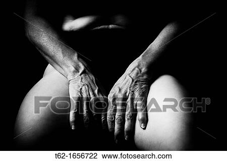 Stock Image - The passage of time on their hands and the body of a old woman. Fotosearch