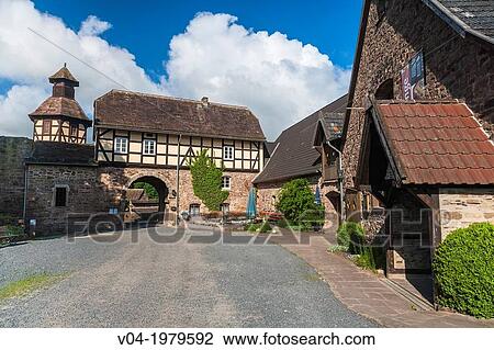 Stock Image - The picturesque moated castle of Wuelmersen, Hesse, Germany, Europe. Fotosearch