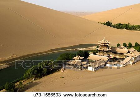 The picturesque temple by the Mingsha sand dunes in Dunhuang, Gansu, China. View Large Photo Image Stock Image - The picturesque temple by the Mingsha sand dunes in Dunhuang, Gansu, China.. Fotosearch