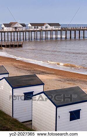 Stock Photography - The pier and beach huts in Southwold, Suffolk, England, Britain, UK.. Fotosearch