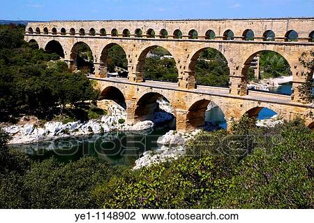 The Pont du Gard, an ancient Roman aqueduct bridge that crosses the Gardon river, Gard, France. View Large Photo Image Stock Image - The Pont du Gard, an ancient Roman aqueduct bridge that crosses the Gardon river, Gard, France.. Fotosearch