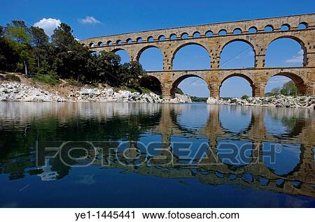 The Pont du Gard, an ancient Roman aqueduct bridge that crosses the Gardon river, Gard, France. View Large Photo Image Stock Image - The Pont du Gard, an ancient Roman aqueduct bridge that crosses the Gardon river, Gard, France.. Fotosearch