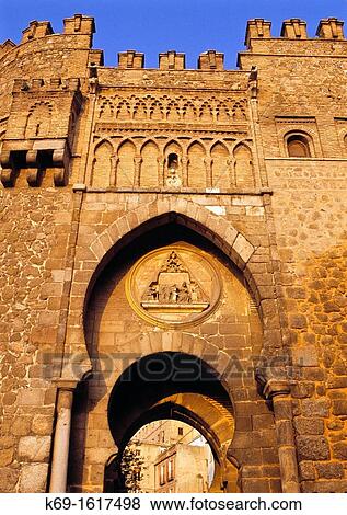 The Puerta del Sol was once the principal gateway into the ancient walled city of Toledo It leads directly to the Puerta de Bisagra and the Cristo de la Luz Mosque View Large Photo Image Stock Photo - The Puerta del Sol was once the principal gateway into the ancient walled city of Toledo It leads directly to the Puerta de Bisagra and the Cristo de la Luz Mosque. Fotosearch