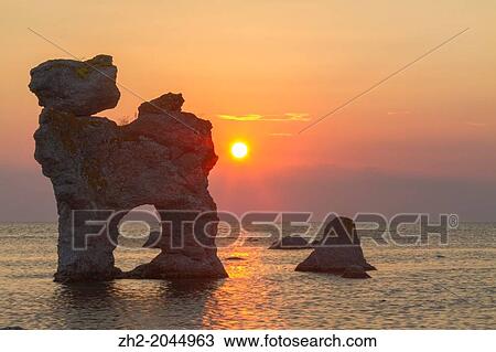 Stock Image - The rauk? The dog? in sunset on F? ro on Gotland, Sweden. Fotosearch
