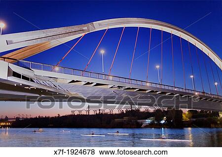 The river Guadalquivir Bridge of La Barqueta Seville, Andalusia, Spain View Large Photo Image Stock Photo - The river Guadalquivir Bridge of La Barqueta Seville, Andalusia, Spain. Fotosearch