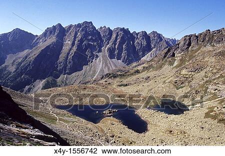 The rugged High Tatras's peaks in Mengusovska dolina seen from the track leading to the summit of Rysy View Large Photo Image Stock Image - The rugged High Tatras's peaks in Mengusovska dolina seen from the track leading to the summit of Rysy. Fotosearch
