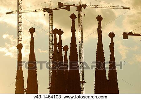 The Sagrada Familia towers and their cranes at dusk in Barcelona, Catalonia, Spain View Large Photo Image Stock Image - The Sagrada Familia towers and their cranes at dusk in Barcelona, Catalonia, Spain. Fotosearch