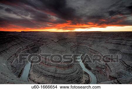 The San Juan River winds its way through the landscape in the shape of a Goose's neck, at sunset, at Gooseneck State Park, Utah View Large Photo Image Picture - The San Juan River winds its way through the landscape in the shape of a Goose's neck, at sunset, at Gooseneck State Park, Utah. Fotosearch