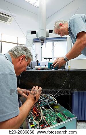 Stock Photo - The SAT team calibrating three-dimensional machine. Calibration of CMM. Coordinate Measuring Machine. Innovative Metrology applied. Sariki Metrology. Elgoibar. Gipuzkoa. Basque Country. Spain.. Fotosearch