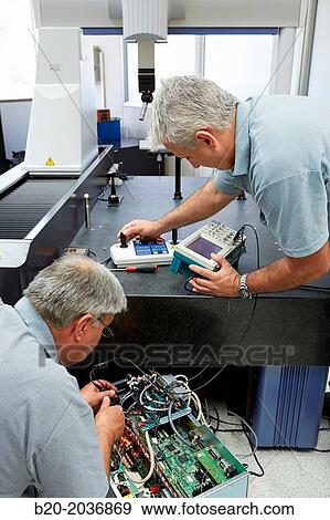 Stock Photo - The SAT team calibrating three-dimensional machine. Calibration of CMM. Coordinate Measuring Machine. Innovative Metrology applied. Sariki Metrology. Elgoibar. Gipuzkoa. Basque Country. Spain.. Fotosearch