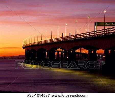 Stock Photo - The Second Severn Crossing over the River Severn between England and Wales seen from Severn Beach in Gloucestershire, United Kingdom. Fotosearch