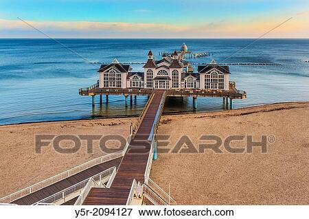 The Sellin Pier is a pier at the Baltic Sea. The pier is 394 meters long. It was inaugurated in 1998, Sellin, Ruegen Island, County Vorpommern-Ruegen, Mecklenburg-Western Pomerania, Germany, Europe. View Large Photo Image Stock Photo - The Sellin Pier is a pier at the Baltic Sea. The pier is 394 meters long. It was inaugurated in 1998, Sellin, Ruegen Island, County Vorpommern-Ruegen, Mecklenburg-Western Pomerania, Germany, Europe.. Fotosearch