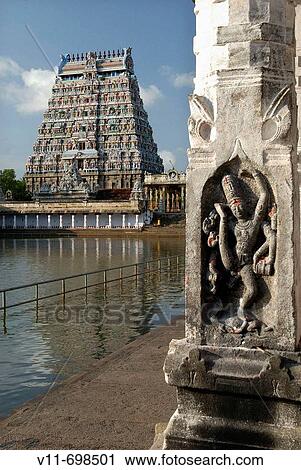 The Shivaganga tank surrounded by colonnades in the third prakara, with the north gopura beyond. Urdhava Tandava sculpture on a pillar. View Large Photo Image Stock Image - The Shivaganga tank surrounded by colonnades in the third prakara, with the north gopura beyond. Urdhava Tandava sculpture on a pillar.. Fotosearch