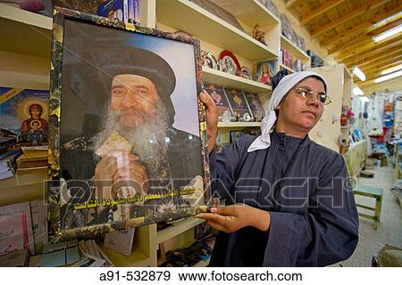The shop selling (more or less) religious items. Theodoros El-Morhab coptic church and monastery on first sunday after Easter. West bank of river Nile. Luxor. Egypt View Large Photo Image Stock Photo - The shop selling (more or less) religious items. Theodoros El-Morhab coptic church and monastery on first sunday after Easter. West bank of river Nile. Luxor. Egypt. Fotosearch