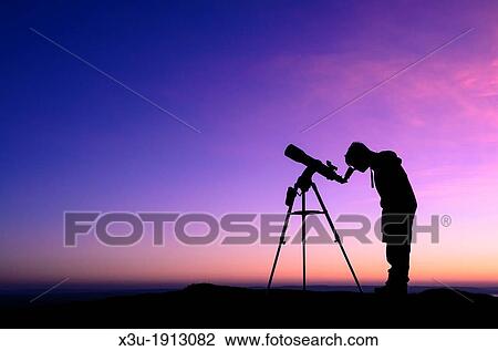 The silhouette of a teenage boy stargazing with a telescope at dusk View Large Photo Image Stock Image - The silhouette of a teenage boy stargazing with a telescope at dusk. Fotosearch