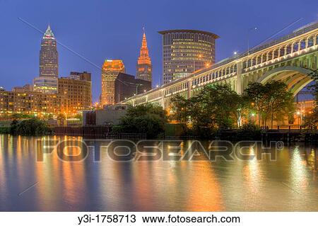 The skyline of Cleveland, Ohio, USA at twilight as viewed over the Cuyahoga River from the Flats. View Large Photo Image Stock Image - The skyline of Cleveland, Ohio, USA at twilight as viewed over the Cuyahoga River from the Flats.. Fotosearch