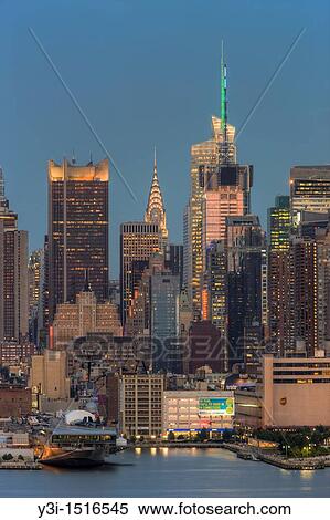 The skyline of Manhattan, New York City, USA at twilight as viewed over the Hudson River from New Jersey View Large Photo Image Stock Photography - The skyline of Manhattan, New York City, USA at twilight as viewed over the Hudson River from New Jersey. Fotosearch