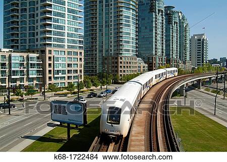 The Skytrain and tracks pass the apartment buldings at the east end of False Creek in Vancouver, BC, Canada View Large Photo Image Picture - The Skytrain and tracks pass the apartment buldings at the east end of False Creek in Vancouver, BC, Canada. Fotosearch