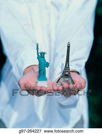 The Statue of liberty and the Eiffel Tower in hand View Large Photo Image Stock Photo - The Statue of liberty and the Eiffel Tower in hand. Fotosearch