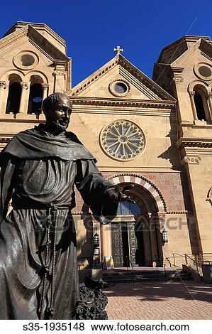 The statue of St. Francis of Assisi the patron saint of Santa Fe in front of the Cathedral Basilica of St. Francis of Assisi. Santa Fe. New Mexico. USA. View Large Photo Image Stock Photo - The statue of St. Francis of Assisi the patron saint of Santa Fe in front of the Cathedral Basilica of St. Francis of Assisi. Santa Fe. New Mexico. USA.. Fotosearch
