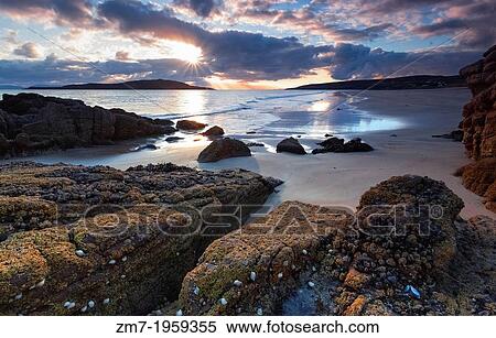 The sun breaks through the cloud at the Sands beach at Gairloch, North West Highlands of Scotland. View Large Photo Image Stock Photography - The sun breaks through the cloud at the Sands beach at Gairloch, North West Highlands of Scotland.. Fotosearch