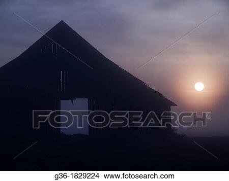The sun rises in the open doorway of a barn in Corcoran, California, United States View Large Photo Image Picture - The sun rises in the open doorway of a barn in Corcoran, California, United States. Fotosearch