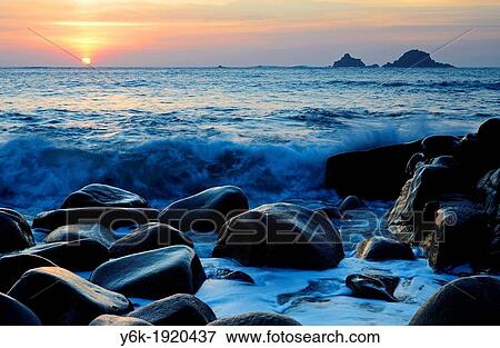 the sun sets on the rocky beach at porth nanven near st just in far west cornwall, england, uk View Large Photo Image Stock Photo - the sun sets on the rocky beach at porth nanven near st just in far west cornwall, england, uk. Fotosearch