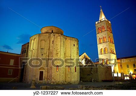 Stock Photo - The The pre-Romanesque Byzantine St Donat's Church & the campanile bell tower of the St Anastasia Cathedral, Zadar, Croatia. Fotosearch