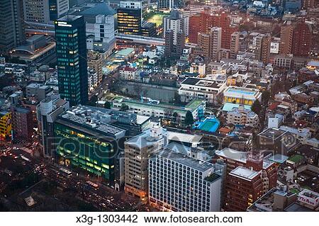 Stock Image - The Tokyo Metropolitan Government Building offers free trips to its upper observation decks and gives sweeping views over the Tokyo city center. This is a view from atop the tower. Japan. Fotosearch