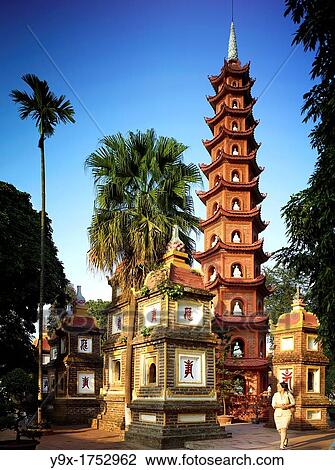 The Tran Quoc Pagoda towering by a temple beside West Lake View Large Photo Image Stock Image - The Tran Quoc Pagoda towering by a temple beside West Lake. Fotosearch