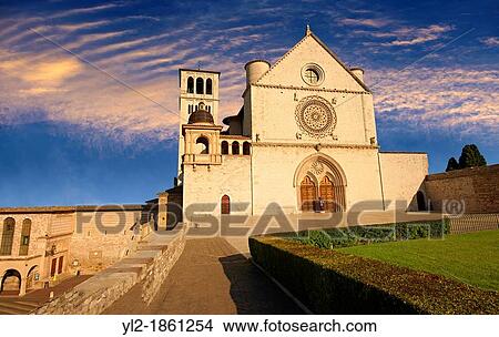 Picture - The upper facade of the Papal Basilica of St Francis of Assisi, Basilica Papale di San Francesco Assisi, Italy. Fotosearch