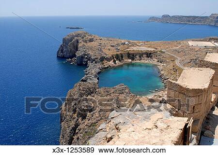 The view of Lindos bay from the acropolis Greek island of Rhodes Greece View Large Photo Image Stock Photo - The view of Lindos bay from the acropolis Greek island of Rhodes Greece. Fotosearch