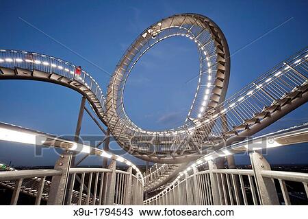 The walkable, large outdoor rollercoaster shaped sculpture Tiger & Turtle Magic Mountain, landmark in Duisburg-Angerhausen, Duisburg, North Rhine-Westphalia, Germany, Europe View Large Photo Image Stock Image - The walkable, large outdoor rollercoaster shaped sculpture Tiger & Turtle Magic Mountain, landmark in Duisburg-Angerhausen, Duisburg, North Rhine-Westphalia, Germany, Europe. Fotosearch