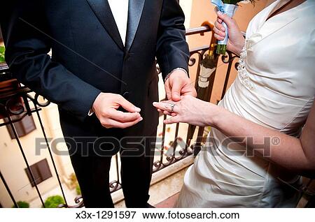 Stock Photo - The wedding ring exchange. Fotosearch
