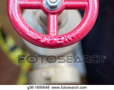 The wheel to a control valve shines in the light of New York, New York, United States View Large Photo Image Stock Photo - The wheel to a control valve shines in the light of New York, New York, United States. Fotosearch