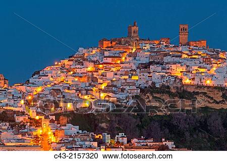 The White Town of Arcos de la Frontera on a limestone rock at dawn. Arcos de la Frontera, CBdiz province, Andalusia, Spain. View Large Photo Image Stock Image - The White Town of Arcos de la Frontera on a limestone rock at dawn. Arcos de la Frontera, CBdiz province, Andalusia, Spain.. Fotosearch