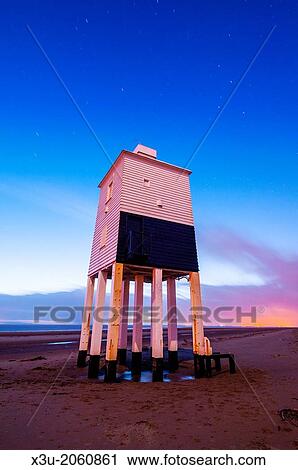 The wooden lighthouse at Burnham-on-Sea overlooking Bridgwater Bay at Dusk, Somerset, England, United Kingdom. Short star trails are visible in the sky. View Large Photo Image Stock Image - The wooden lighthouse at Burnham-on-Sea overlooking Bridgwater Bay at Dusk, Somerset, England, United Kingdom. Short star trails are visible in the sky.. Fotosearch