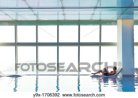 Stock Image - The world's highest swimming pool on the top floor of the Ritz Carlton at the International Commerce Centre in Hong Kong. Fotosearch