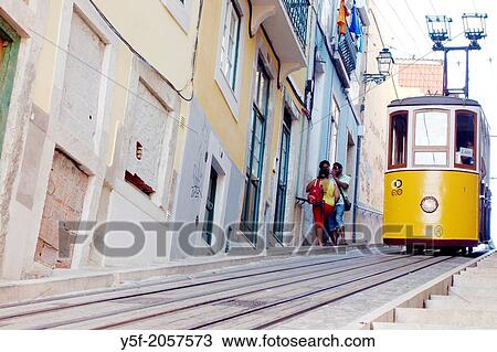 The yellow tram at the Bica neighborhood of Lisbon. View Large Photo Image Stock Image - The yellow tram at the Bica neighborhood of Lisbon.. Fotosearch