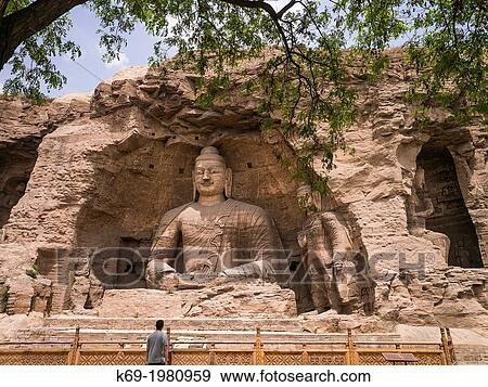 The Yungang Grottoes (Wuzhoushan Grottoes in ancient time) are ancient Chinese Buddhist temple grottoes near the city of Datong in the province of Shanxi. View Large Photo Image Stock Photo - The Yungang Grottoes (Wuzhoushan Grottoes in ancient time) are ancient Chinese Buddhist temple grottoes near the city of Datong in the province of Shanxi.. Fotosearch