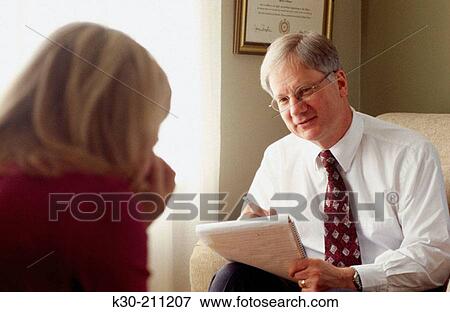 Therapist and Patient in a Counseling Session View Large Photo Image Stock Photo - Therapist and Patient in a Counseling Session. Fotosearch