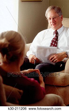 Therapist and Patient in a Counseling Session View Large Photo Image Stock Photograph - Therapist and Patient in a Counseling Session. Fotosearch